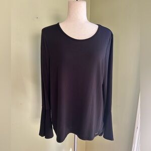 Michael Kors black top. Round neck, long sleeves. w/fluted wrist Size L Nice!